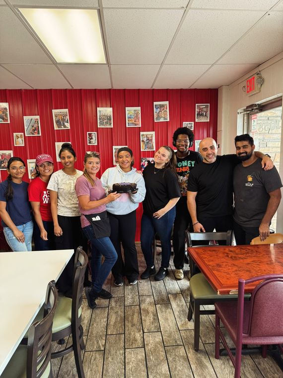 The diner crew gathered in the dining room for a birthday